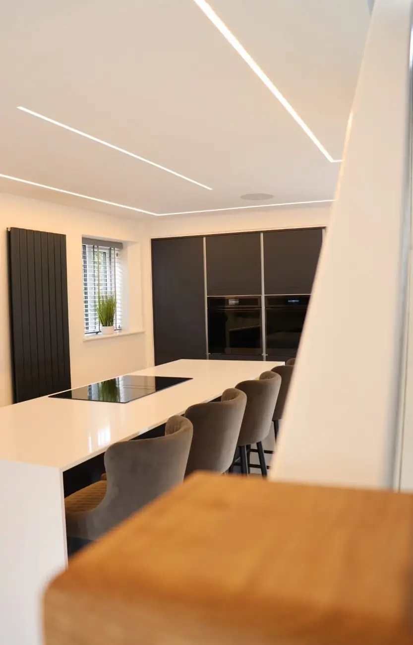 Kitchen island with induction hob and bar stool seating